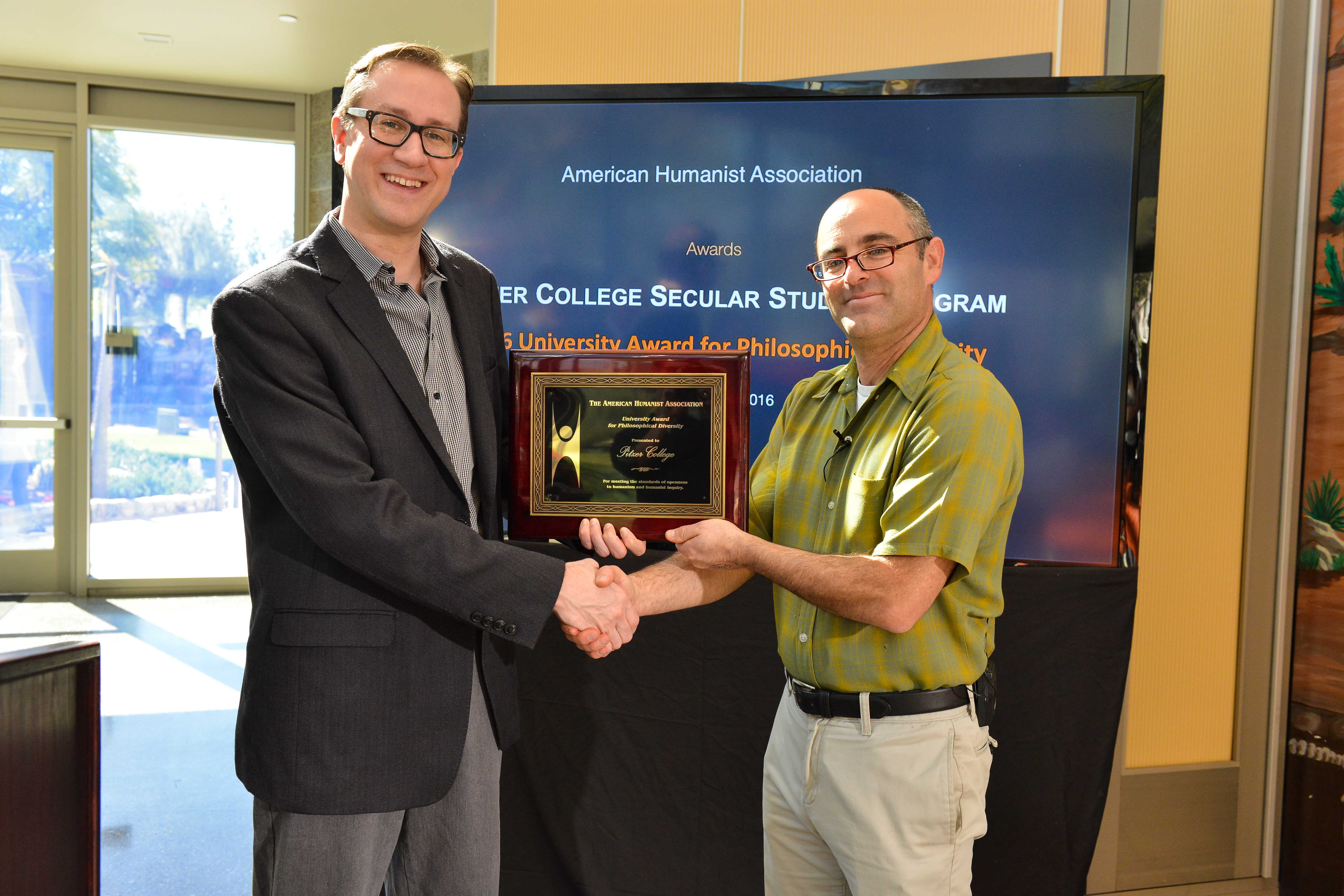 Roy Speckhardt, the American Humanist Association executive director, presenting the award to Phil Zuckerman