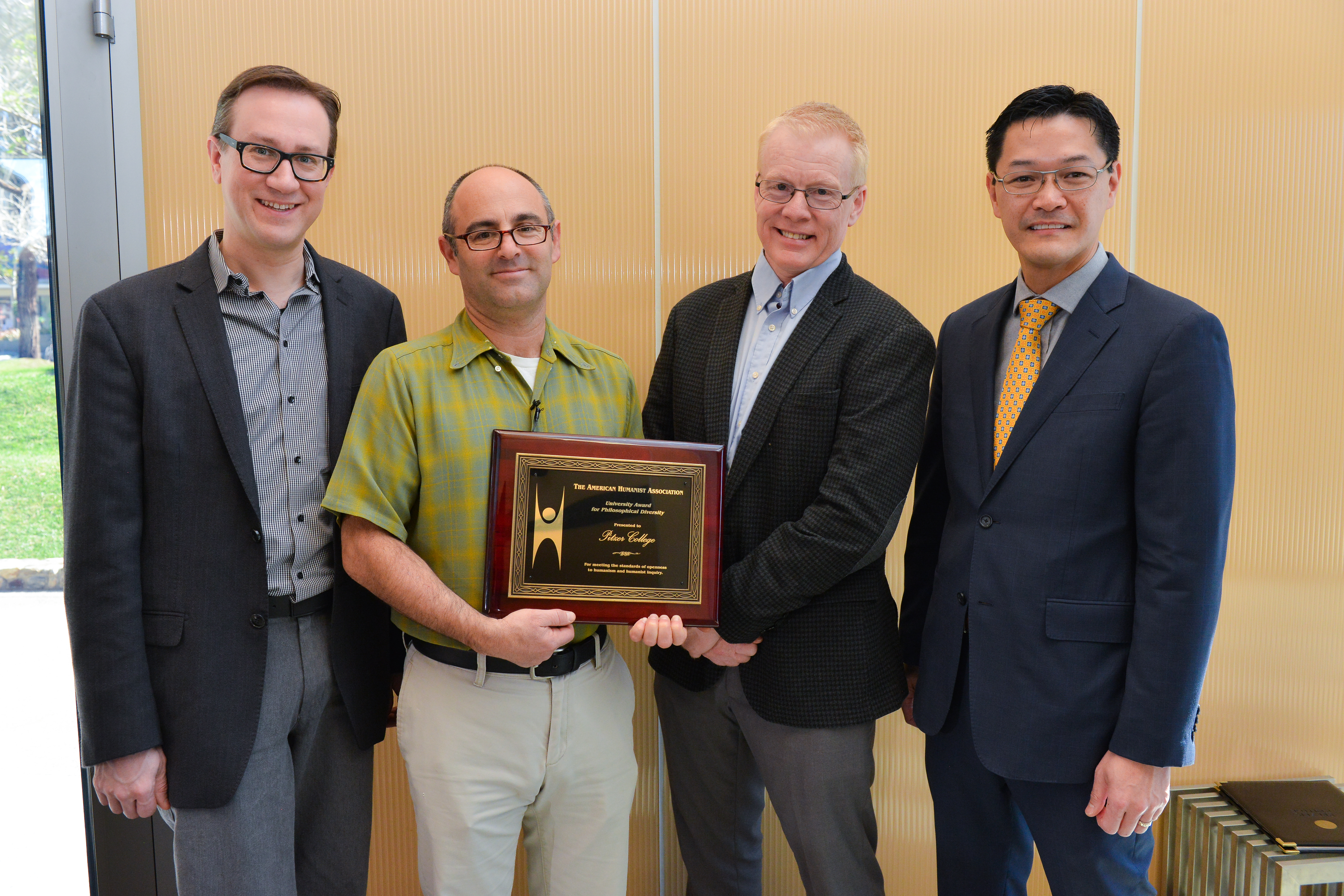 Pitzer college officials, including Dr. Phil Zuckerman, accepting an award from the American Humanist Association, with Executive Director Roy Speckhardt.